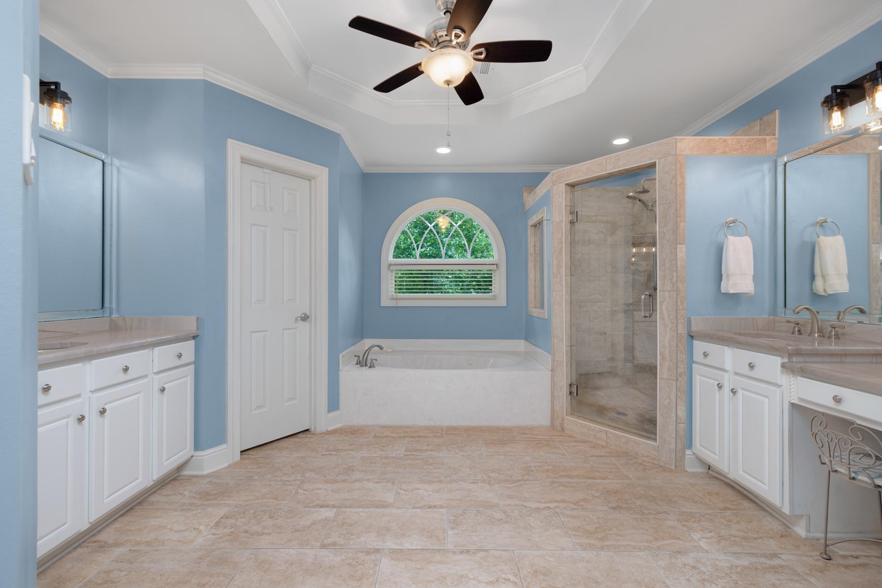 1893 Hartwell Manor West Collierville, TN 38017 - Photo 20 of 40 a bathroom with a granite countertop sink a mirror a bathtub and a shower