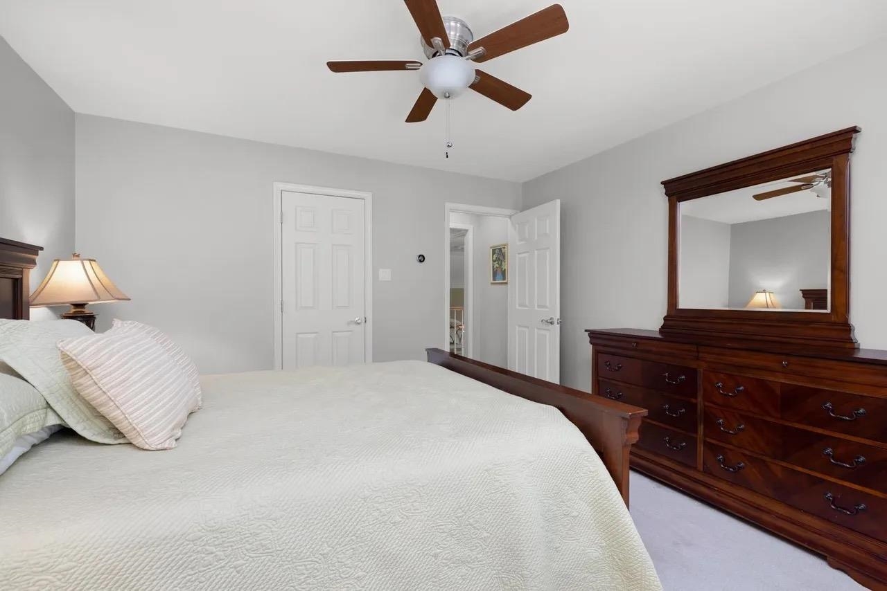 1893 Hartwell Manor West Collierville, TN 38017 - Photo 23 of 40 a bedroom with a bed and a large mirror on a dresser