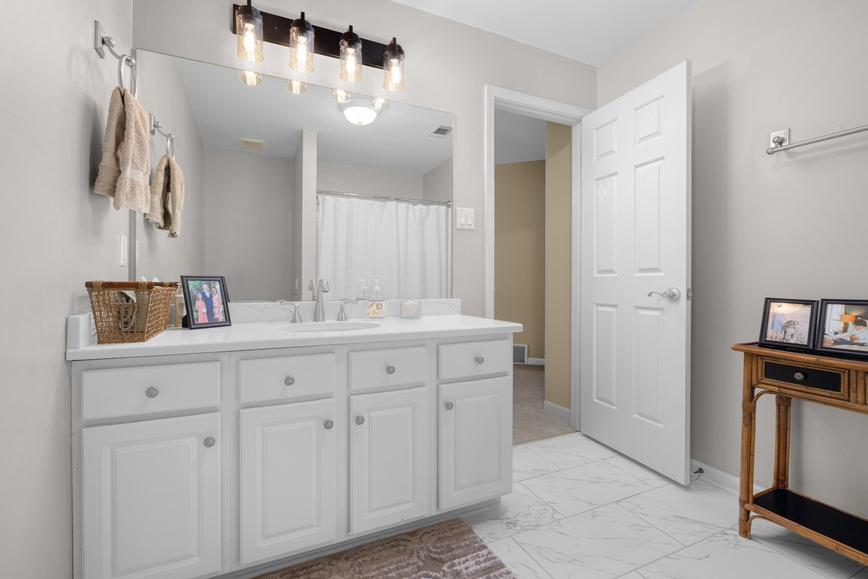 1893 Hartwell Manor West Collierville, TN 38017 - Photo 24 of 40 a spacious bathroom with a double vanity sink a mirror and a shower