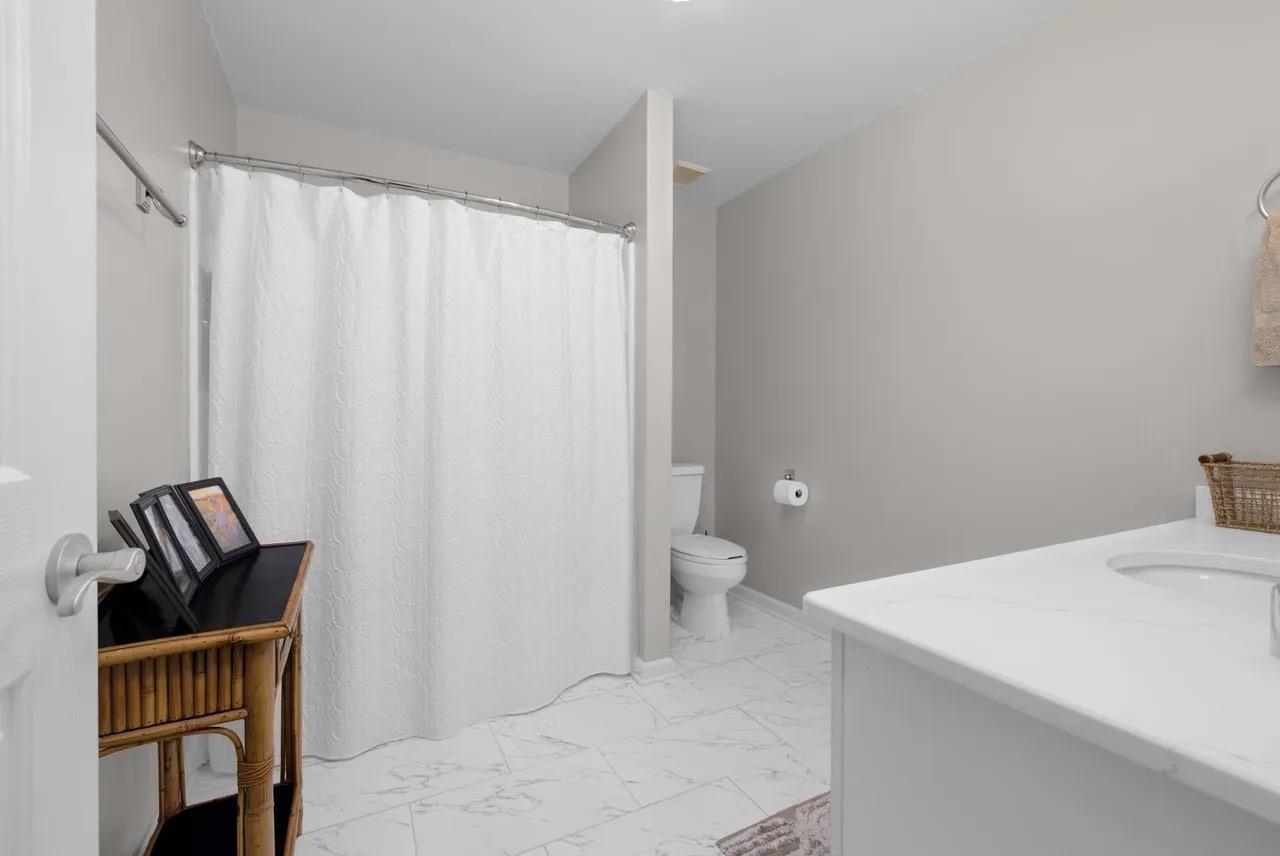 1893 Hartwell Manor West Collierville, TN 38017 - Photo 25 of 40 a bathroom with a sink a toilet and shower