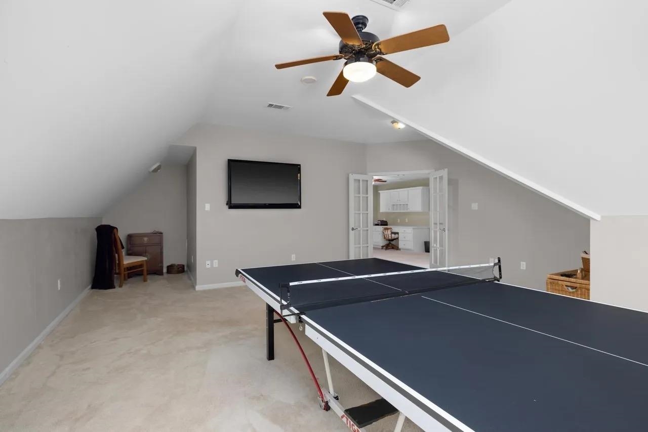 1893 Hartwell Manor West Collierville, TN 38017 - Photo 33 of 40 Playroom featuring lofted ceiling, ceiling fan, light colored carpet, and french doors
