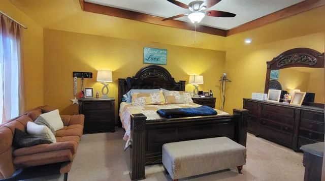 a living room with a couch and a chandelier
