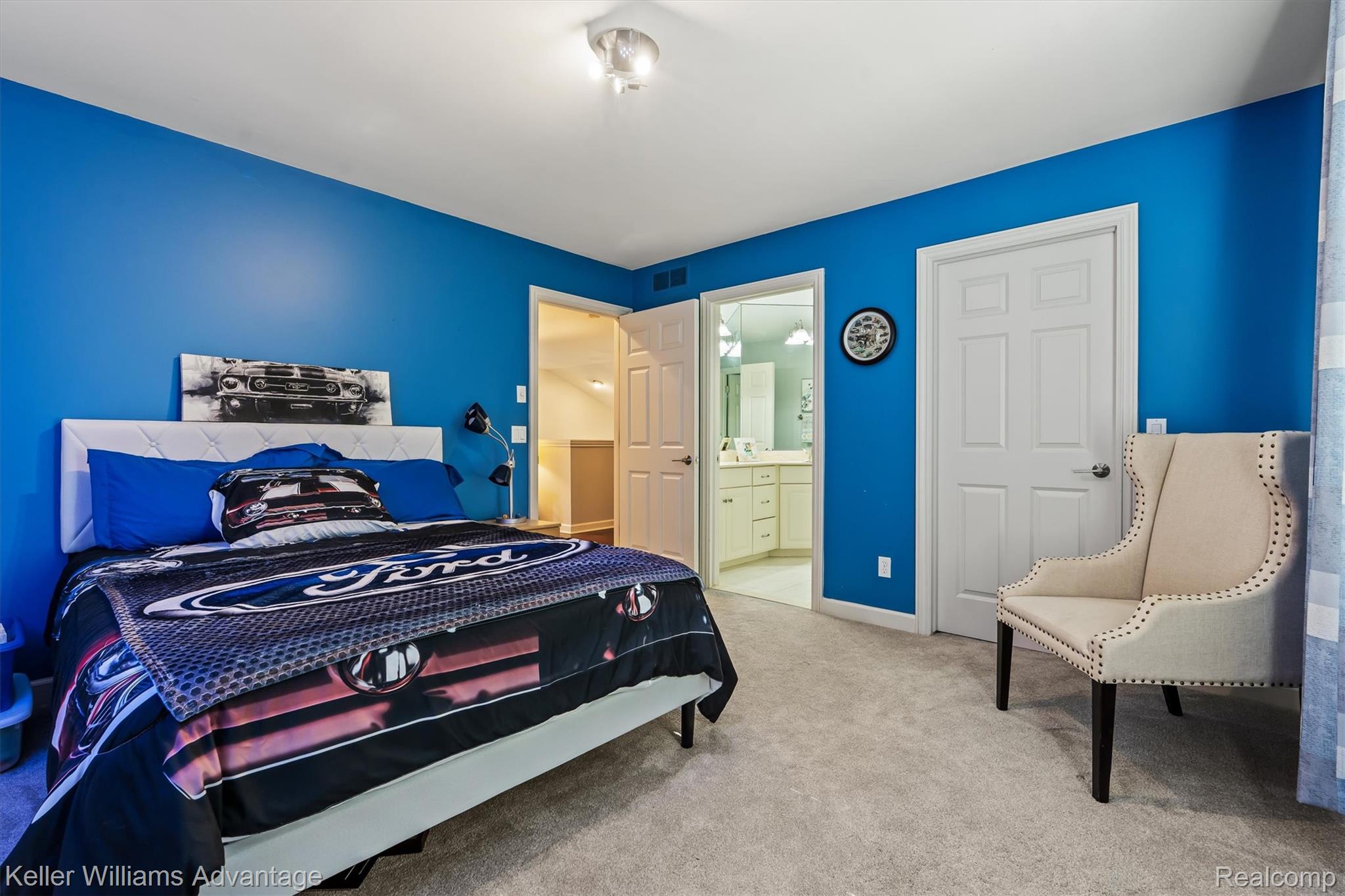 22878 Tree Top Court South Lyon, MI 48178 - Photo 26 of 75 Bedroom featuring plush gray carpeting, bright blue walls, and a ceiling-mounted light fixture