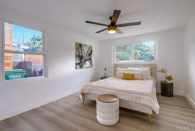 a bedroom with a bed and window