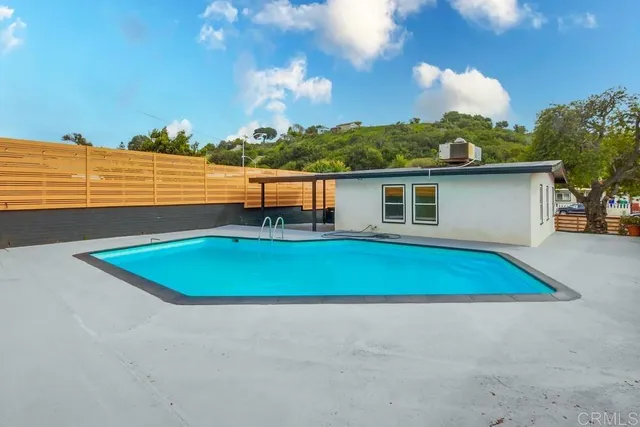 a view of a pool with a yard