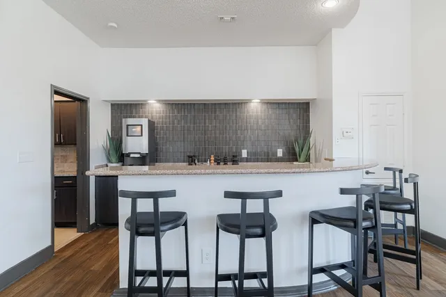 a kitchen with a table and chairs in it