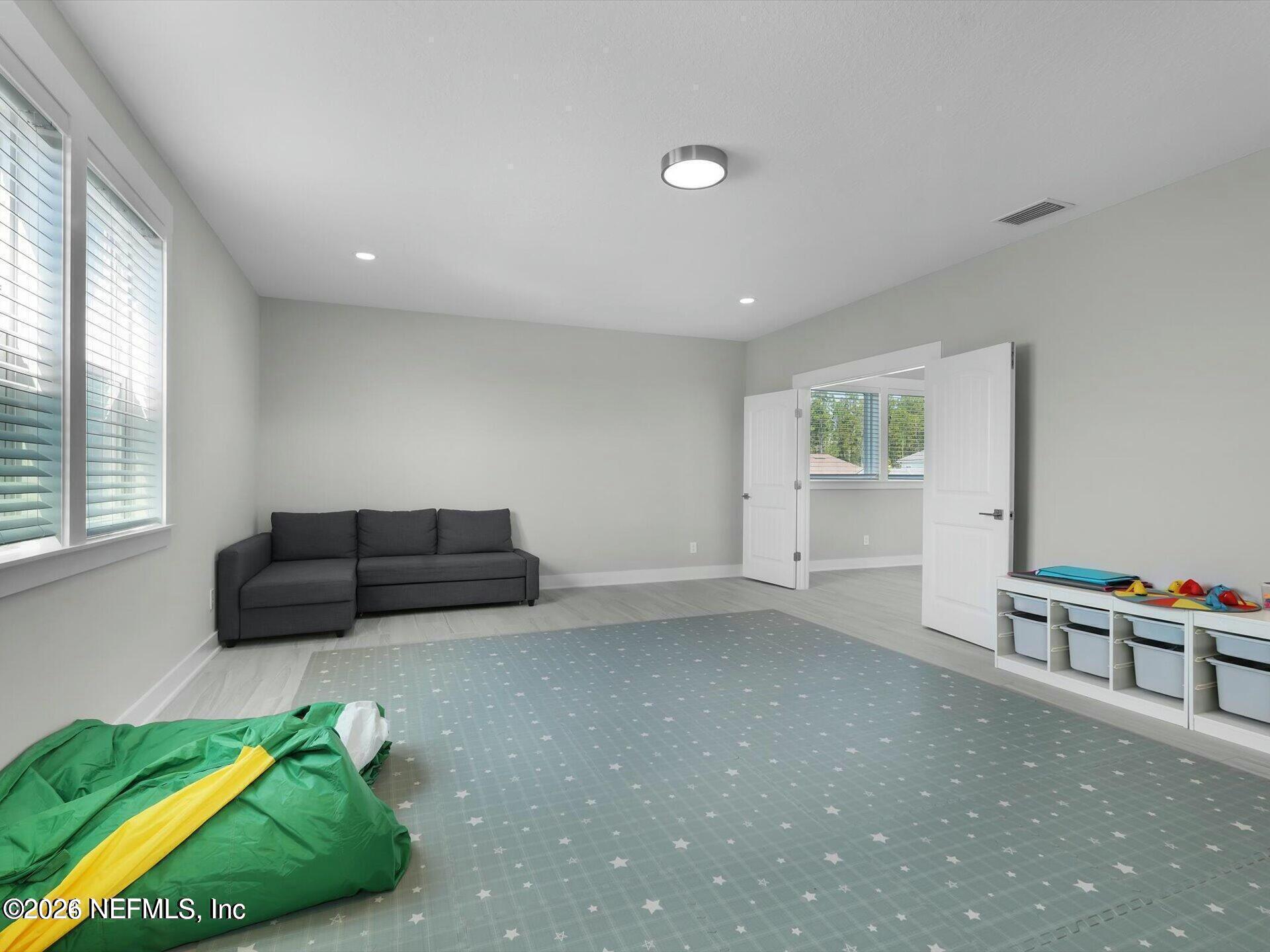 32 Awlleaf Court St. Augustine, FL 32095 - Photo 25 of 40 a room with furniture and a window