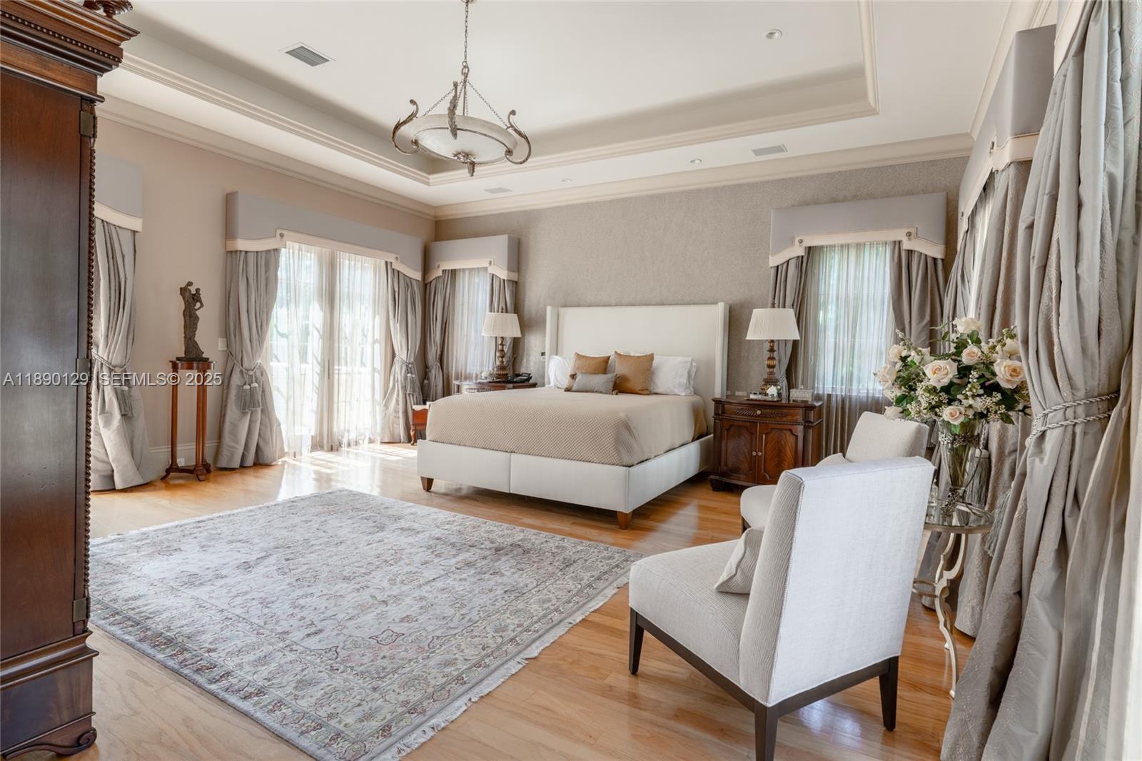 5785 Southwest 96th Street Pinecrest, FL 33156 - Photo 15 of 34 a bedroom with a bed and window