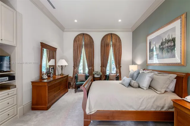 a bedroom with bed and window