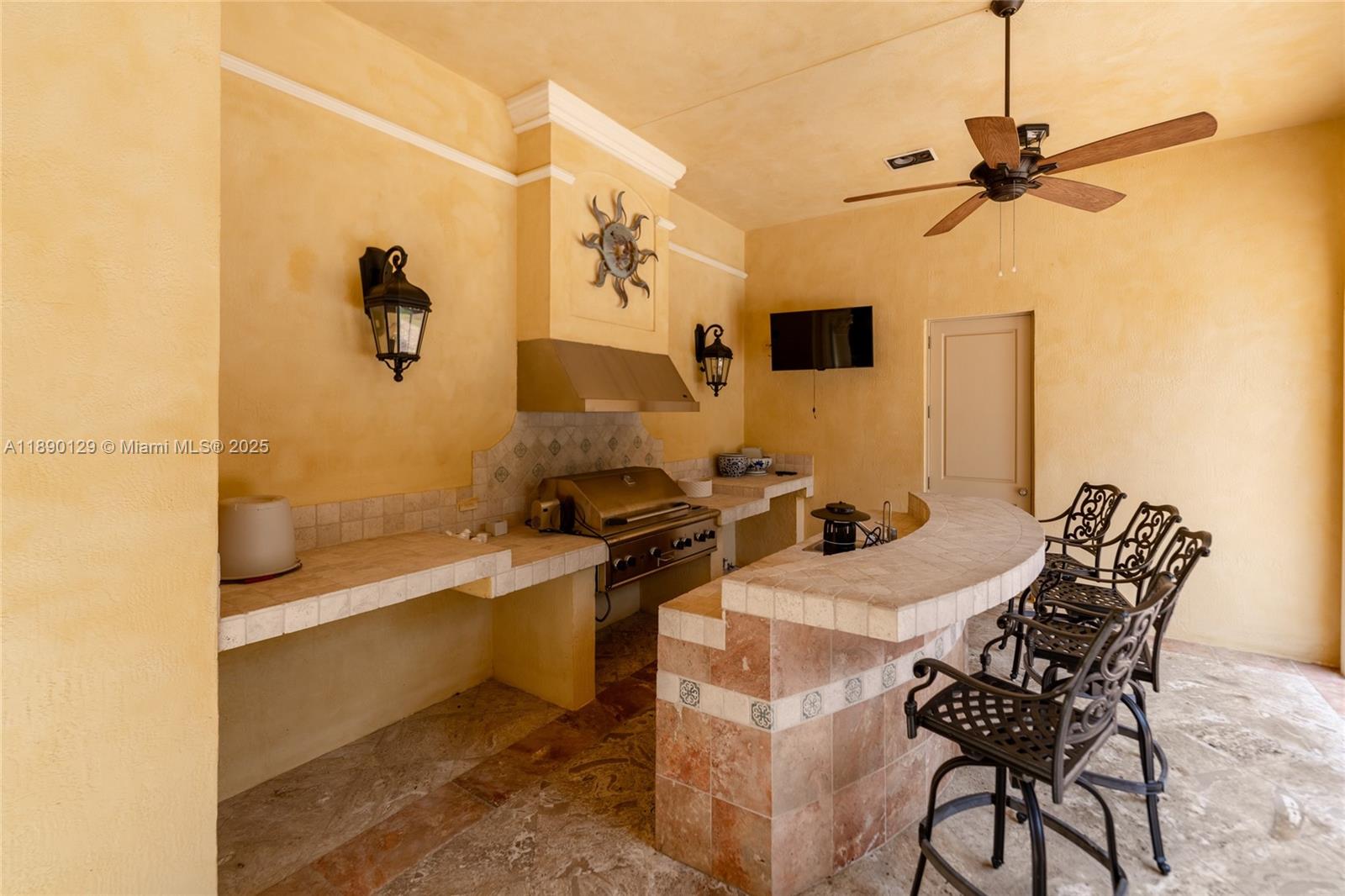 5785 Southwest 96th Street Pinecrest, FL 33156 - Photo 26 of 34 a bathroom with a sink and a mirror