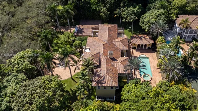 an aerial view of a house with a yard and garden