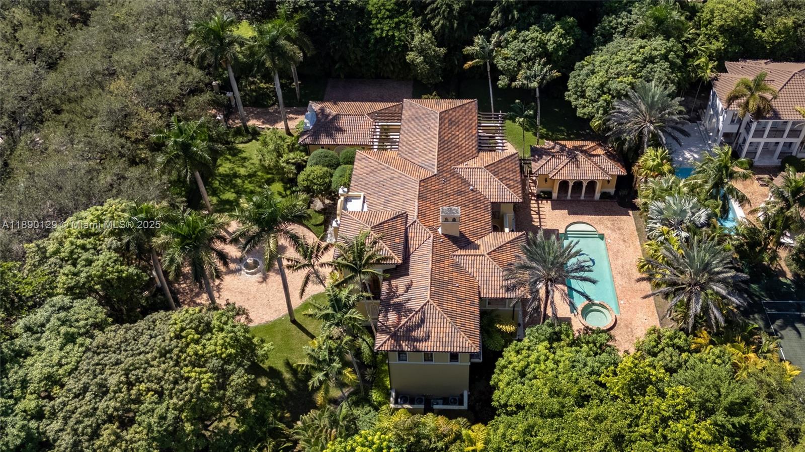 5785 Southwest 96th Street Pinecrest, FL 33156 - Photo 3 of 34 an aerial view of a house with a yard and garden