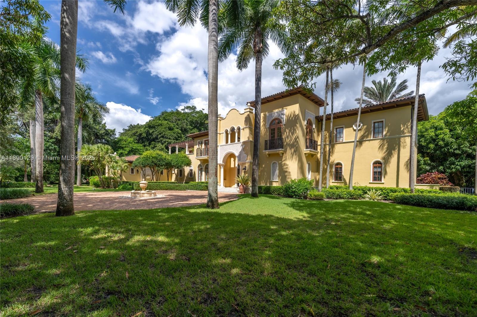 5785 Southwest 96th Street Pinecrest, FL 33156 - Photo 32 of 34 a view of a building with a yard