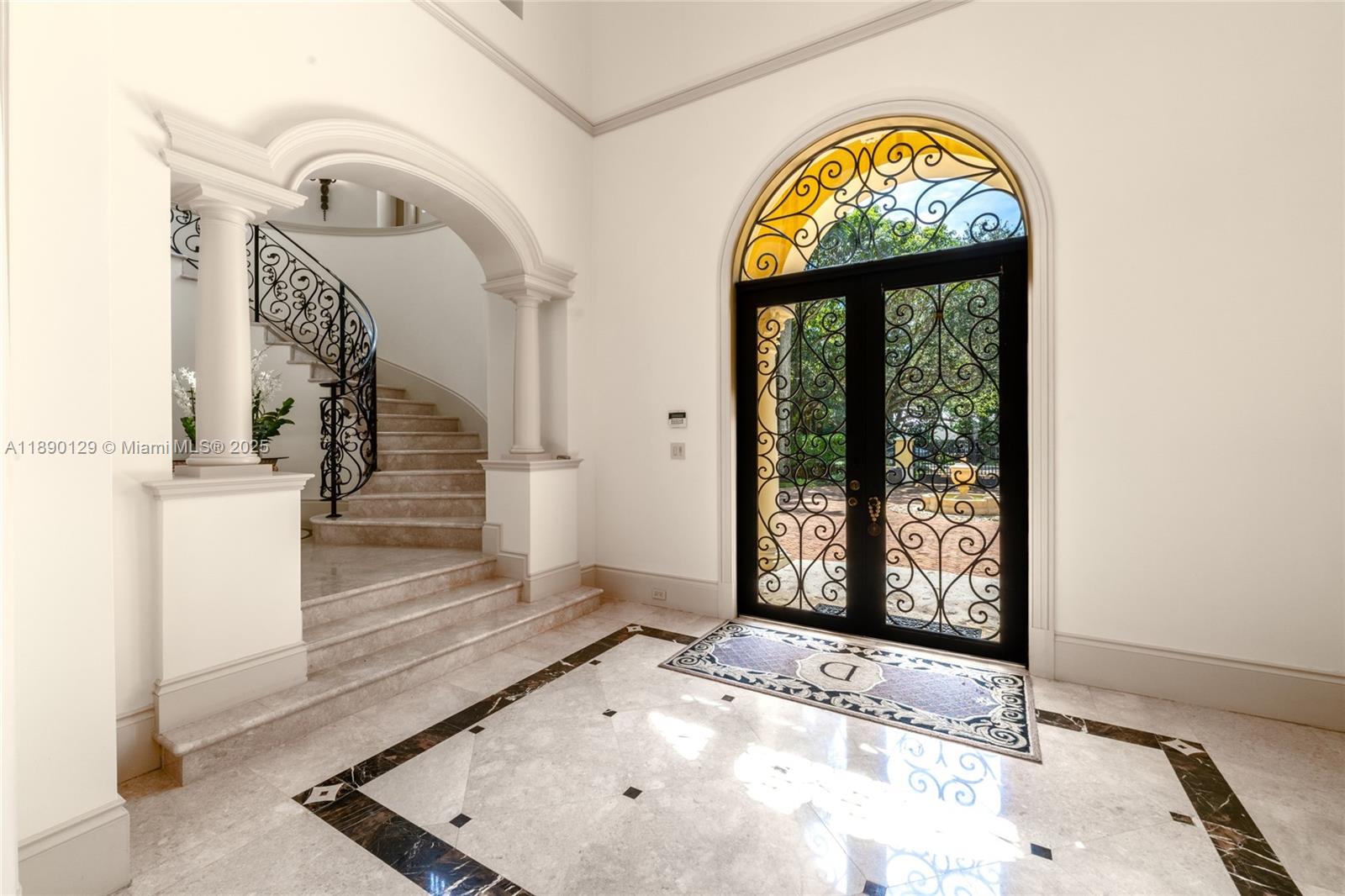 5785 Southwest 96th Street Pinecrest, FL 33156 - Photo 5 of 34 a view of an entryway with wooden floor