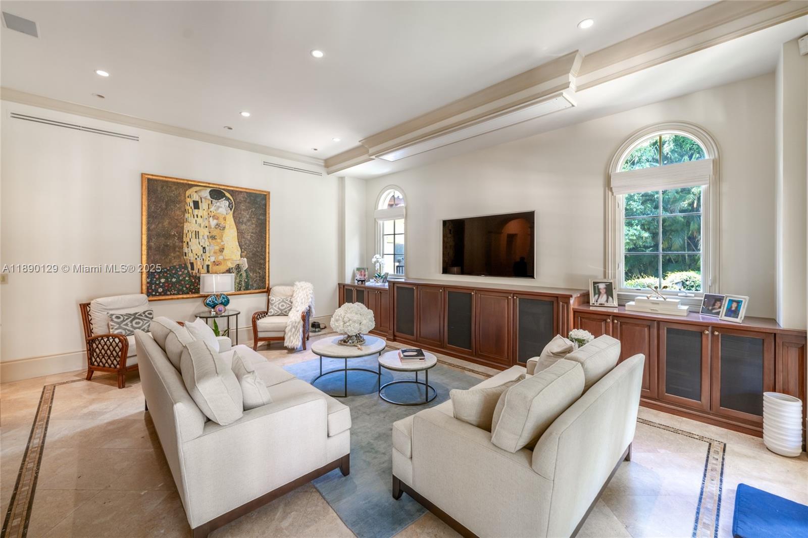 5785 Southwest 96th Street Pinecrest, FL 33156 - Photo 8 of 34 a living room with furniture and a flat screen tv