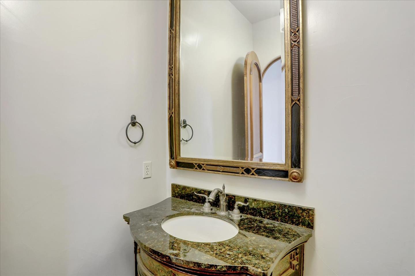 1120 Wallace Road Placerville, CA 95667 - Photo 43 of 70 a bathroom with a granite countertop sink and a mirror