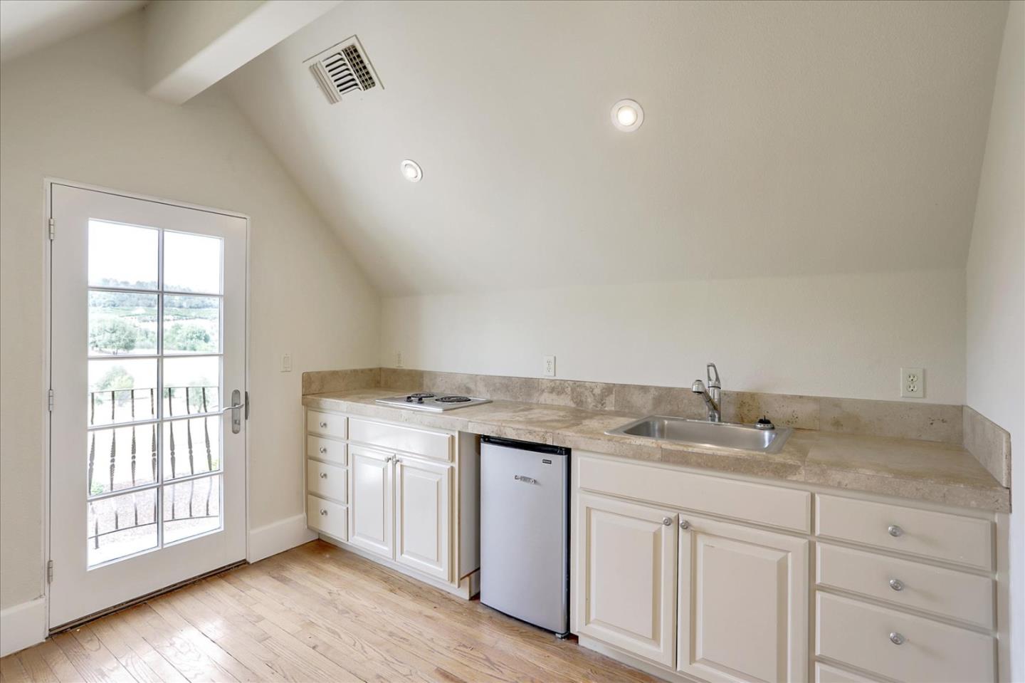 1120 Wallace Road Placerville, CA 95667 - Photo 53 of 70 a bathroom with a granite countertop sink and white cabinets