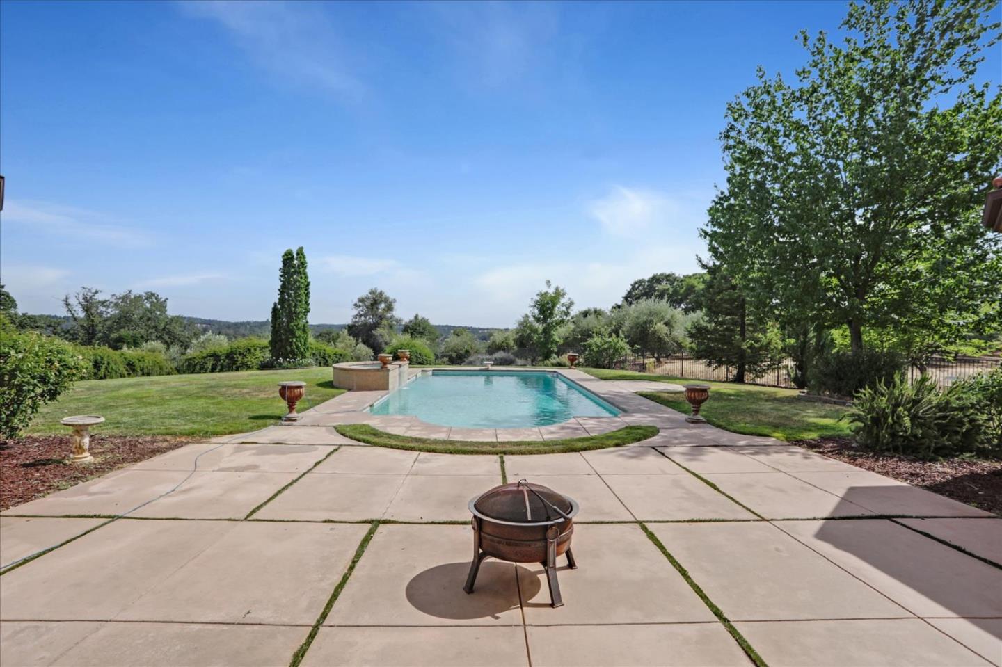 1120 Wallace Road Placerville, CA 95667 - Photo 60 of 70 a backyard of a house with yard fountain and outdoor seating