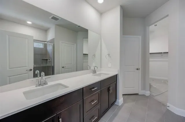 a kitchen with granite countertop stainless steel appliances and wooden cabinets