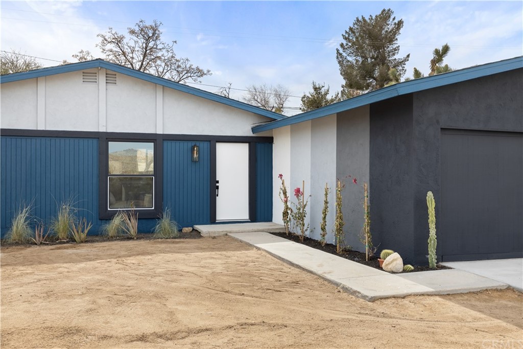 61589 El Reposo Street Joshua Tree, CA 92252 - Photo 1 of 15 a view of outdoor space yard and garage
