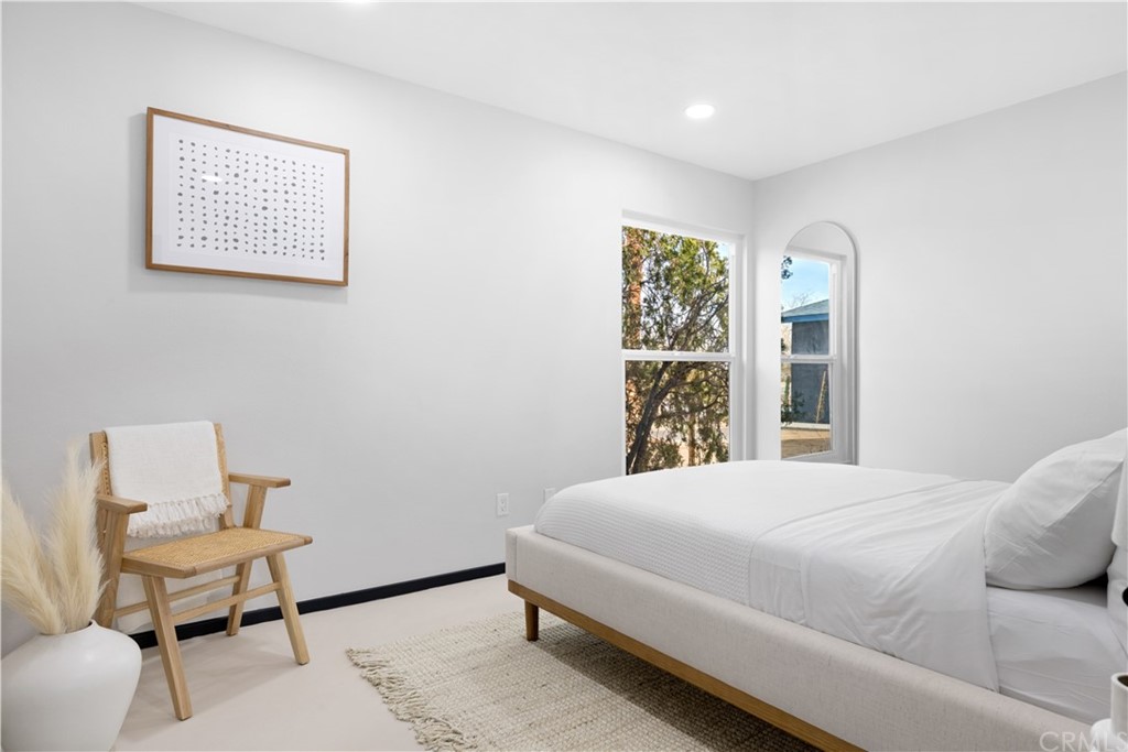 61589 El Reposo Street Joshua Tree, CA 92252 - Photo 11 of 15 a bedroom with a bed and a window