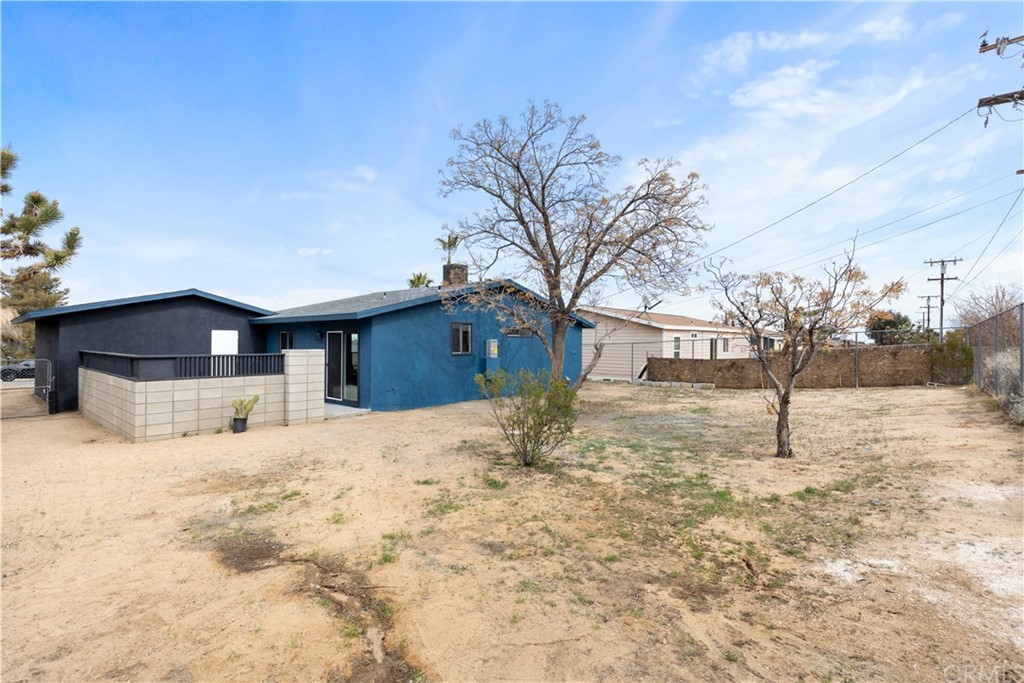 61589 El Reposo Street Joshua Tree, CA 92252 - Photo 14 of 15 a view of a yard covered in snow