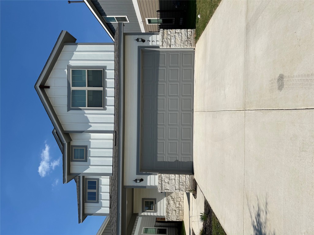 253 Redonda Drive Liberty Hill, TX 78642 - Photo 1 of 18 a bathroom with a sink and a large mirror