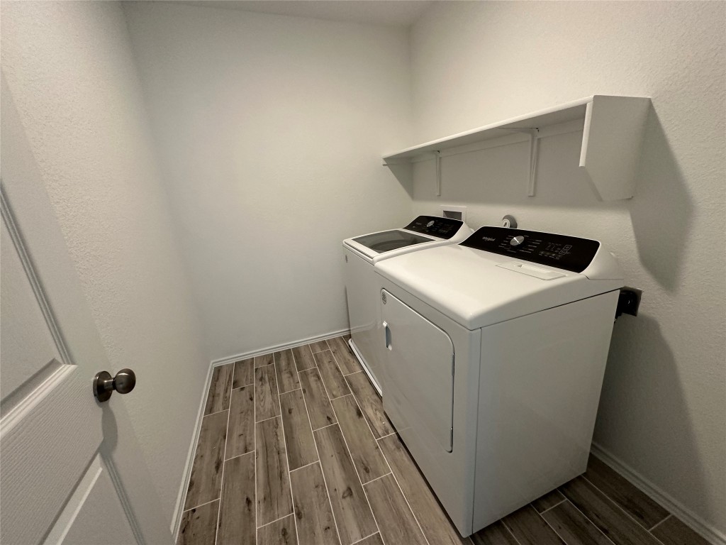 253 Redonda Drive Liberty Hill, TX 78642 - Photo 17 of 18 a utility room with dryer and washer