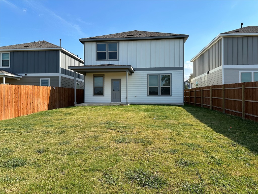 253 Redonda Drive Liberty Hill, TX 78642 - Photo 18 of 18 Back of house with a patio area, a fenced backyard, and roof with shingles