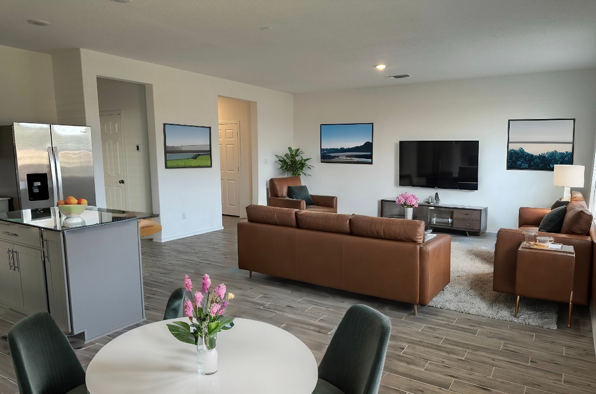 253 Redonda Drive Liberty Hill, TX 78642 - Photo 3 of 18 a living room with furniture and a flat screen tv
