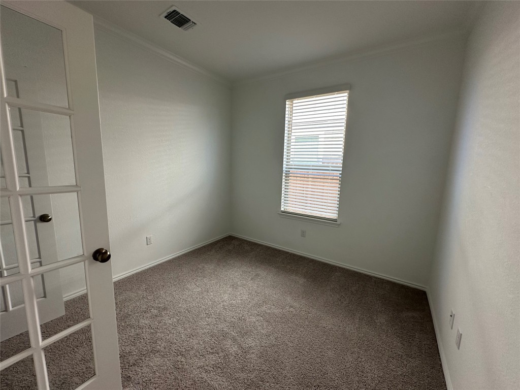 253 Redonda Drive Liberty Hill, TX 78642 - Photo 4 of 18 an empty room with windows