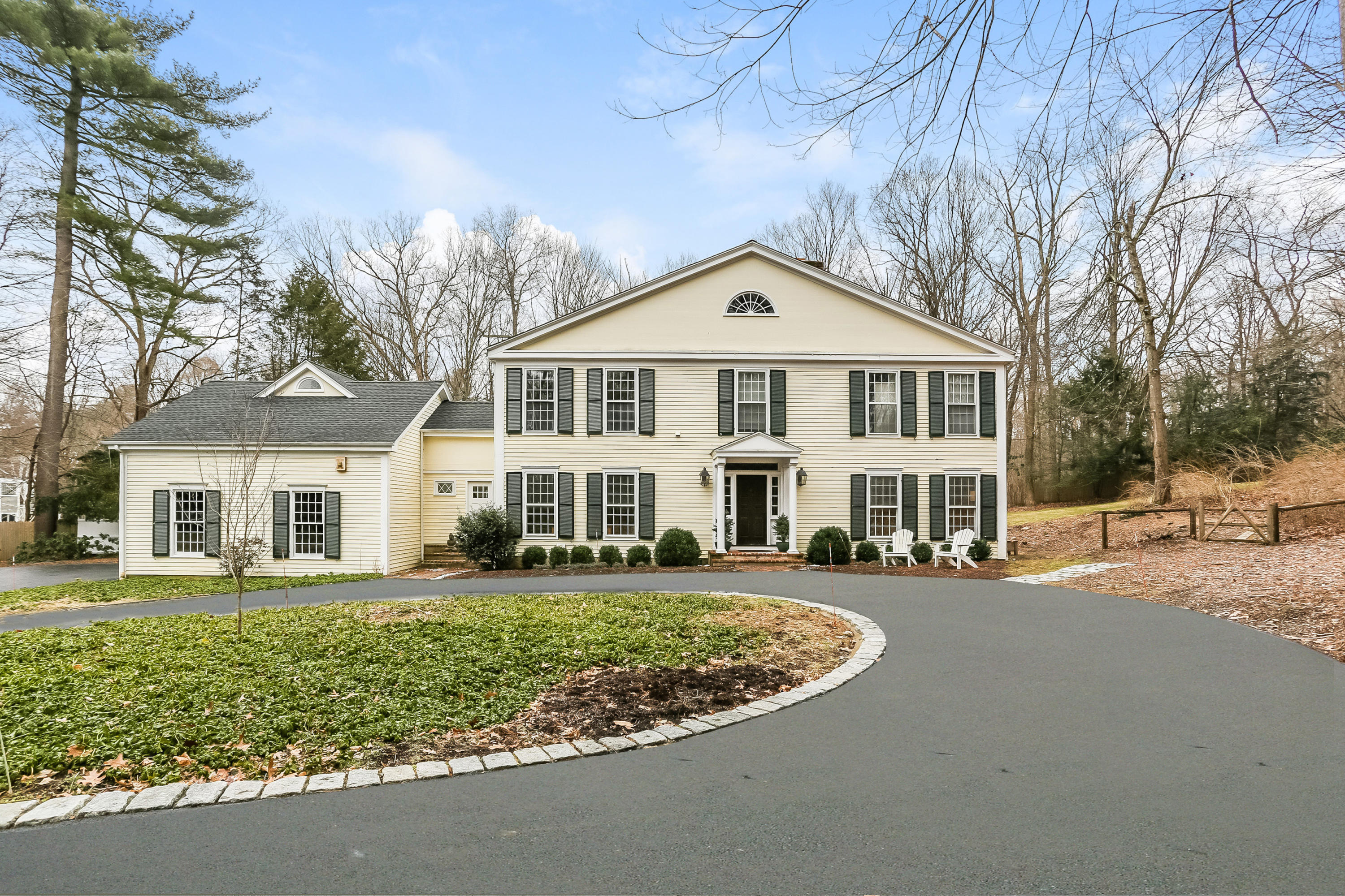 42 Valley Road New Canaan, CT 06840 - Photo 1 of 30 front view of a house with a yard