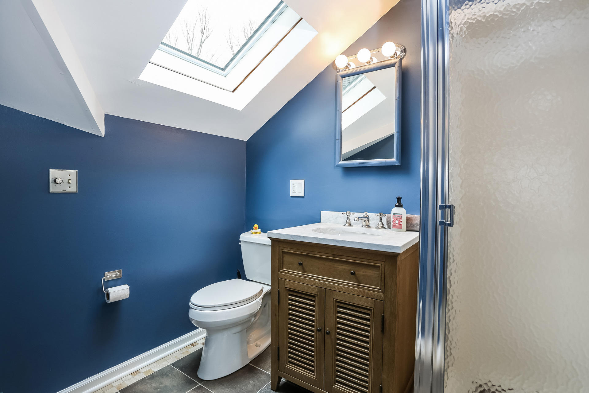 42 Valley Road New Canaan, CT 06840 - Photo 12 of 30 a bathroom with a toilet sink and mirror