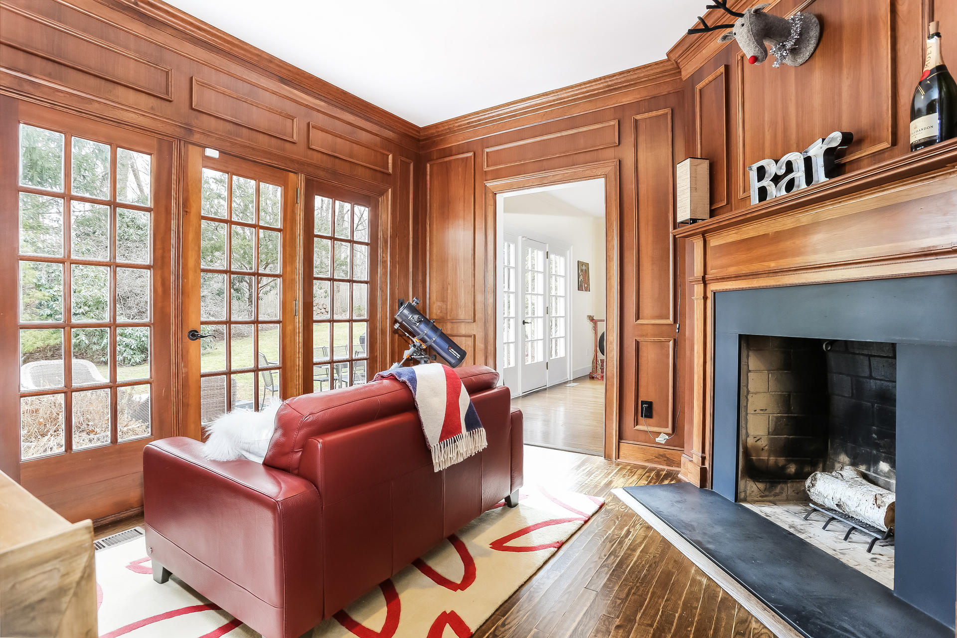 42 Valley Road New Canaan, CT 06840 - Photo 15 of 30 a living room with furniture and a fireplace