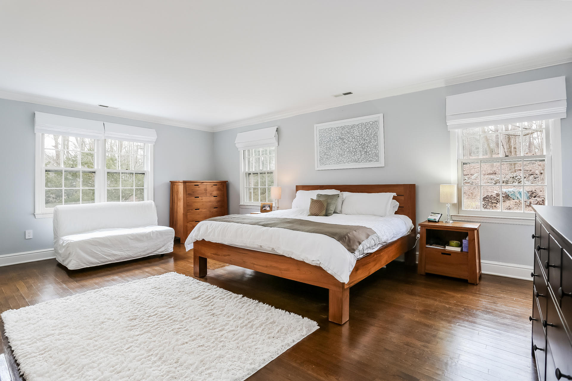 42 Valley Road New Canaan, CT 06840 - Photo 18 of 30 a bedroom with a bed and a couch with window