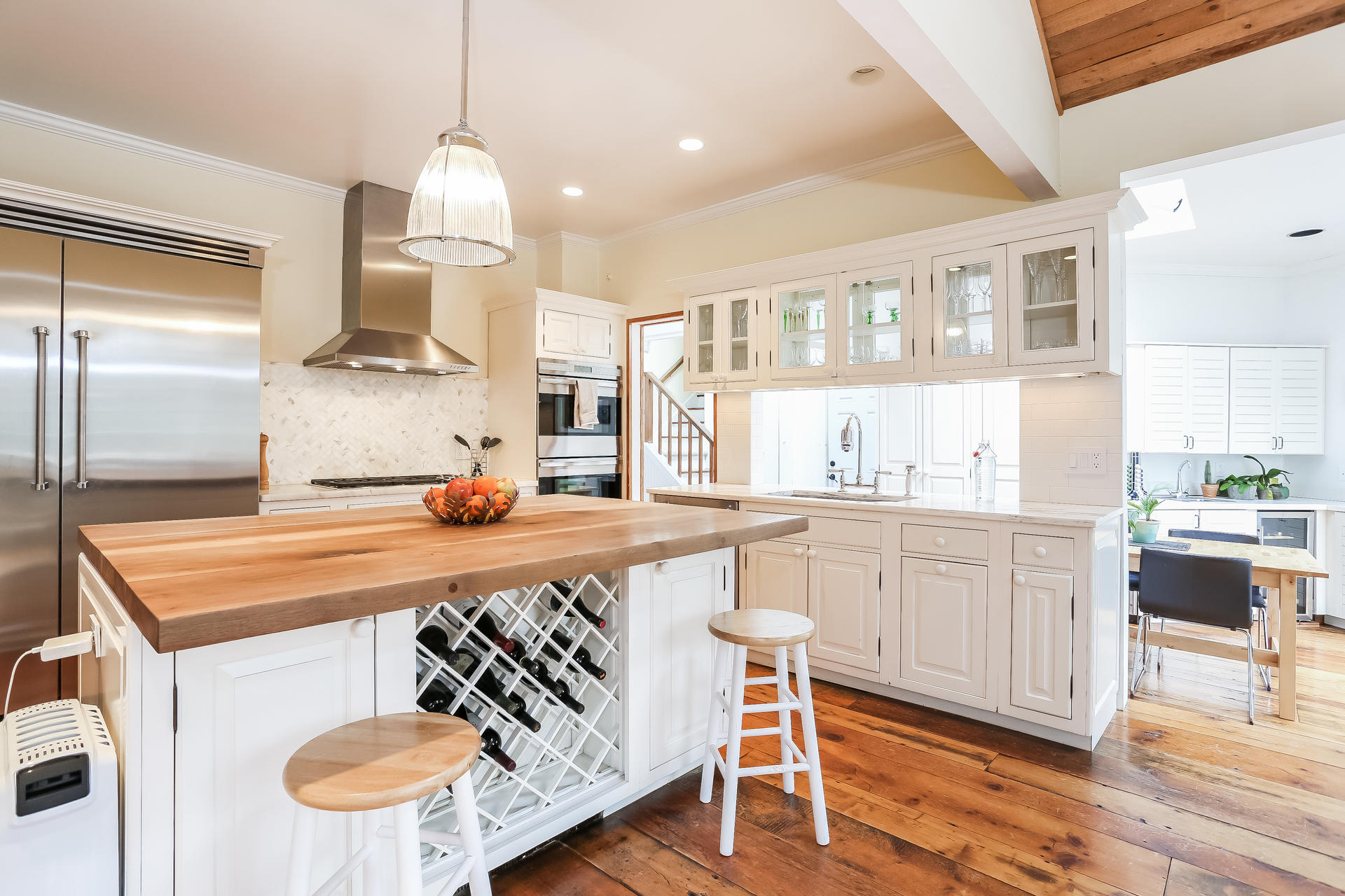 42 Valley Road New Canaan, CT 06840 - Photo 7 of 30 a kitchen with stainless steel appliances granite countertop a sink and a refrigerator