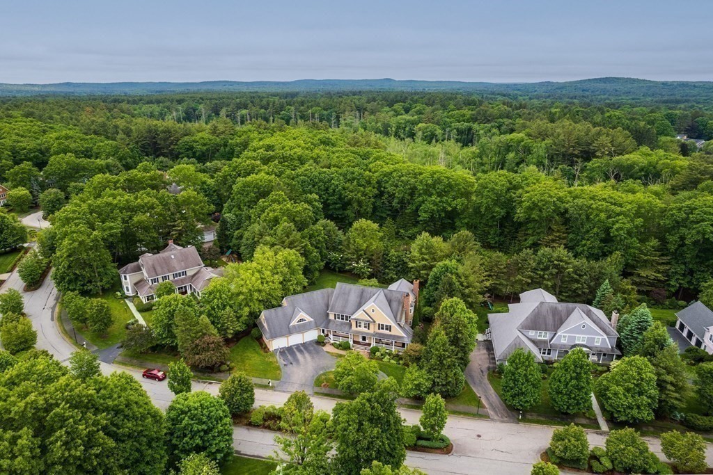96 Beard Way Needham, MA 02492 - Photo 1 of 39 an aerial view of a house with outdoor space and garden