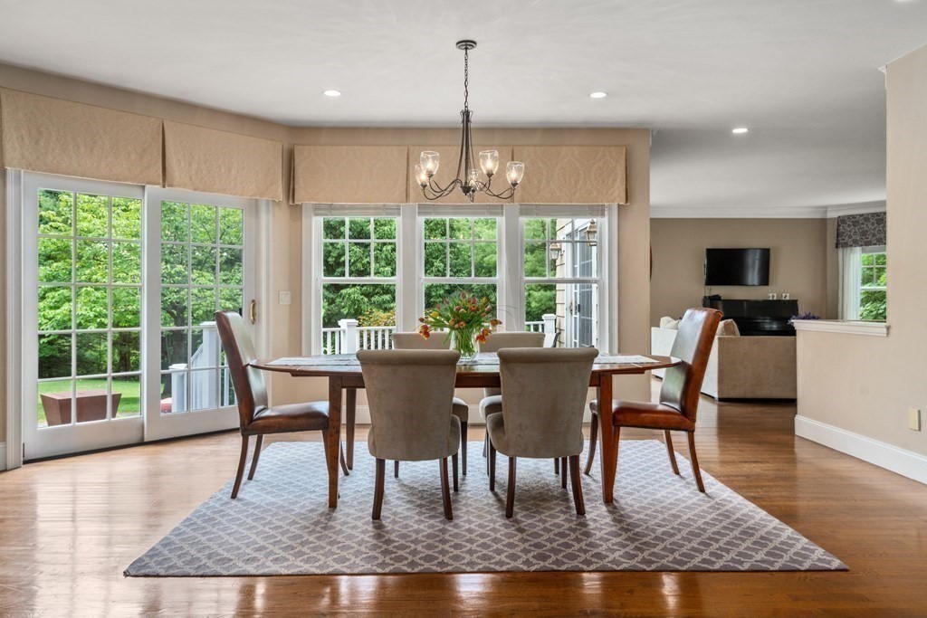 96 Beard Way Needham, MA 02492 - Photo 11 of 39 a view of a dining room with furniture wooden floor and a chandelier