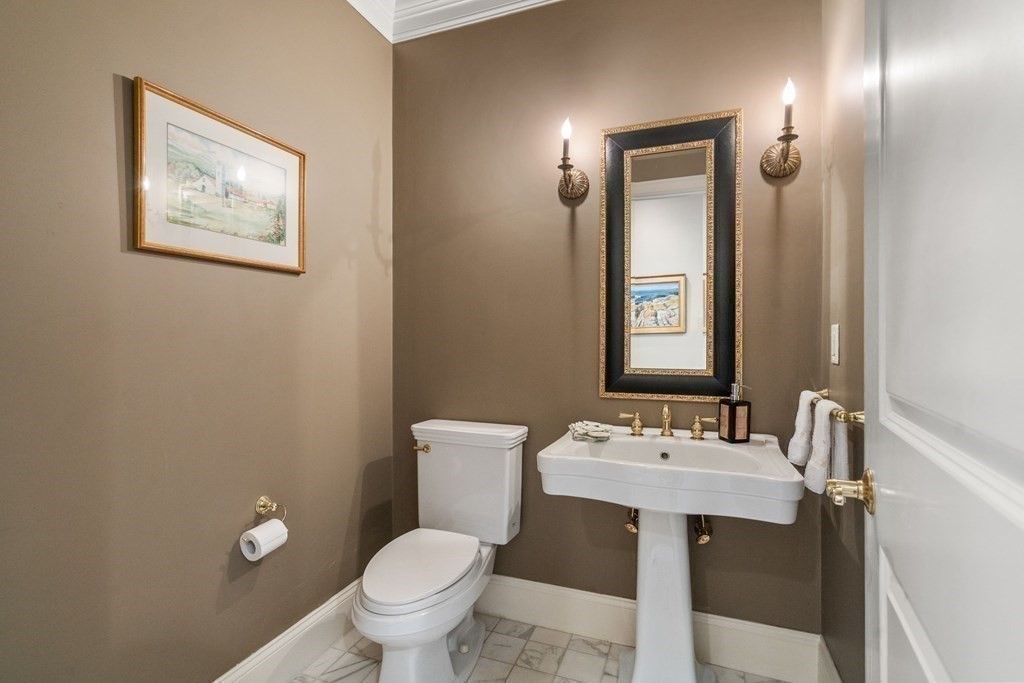 96 Beard Way Needham, MA 02492 - Photo 14 of 39 a bathroom with a toilet a sink and mirror