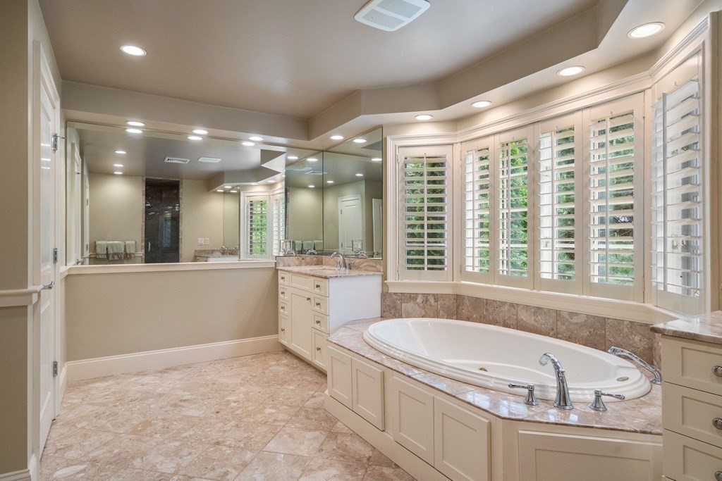 96 Beard Way Needham, MA 02492 - Photo 18 of 39 a bathroom with a granite countertop tub sink and mirror