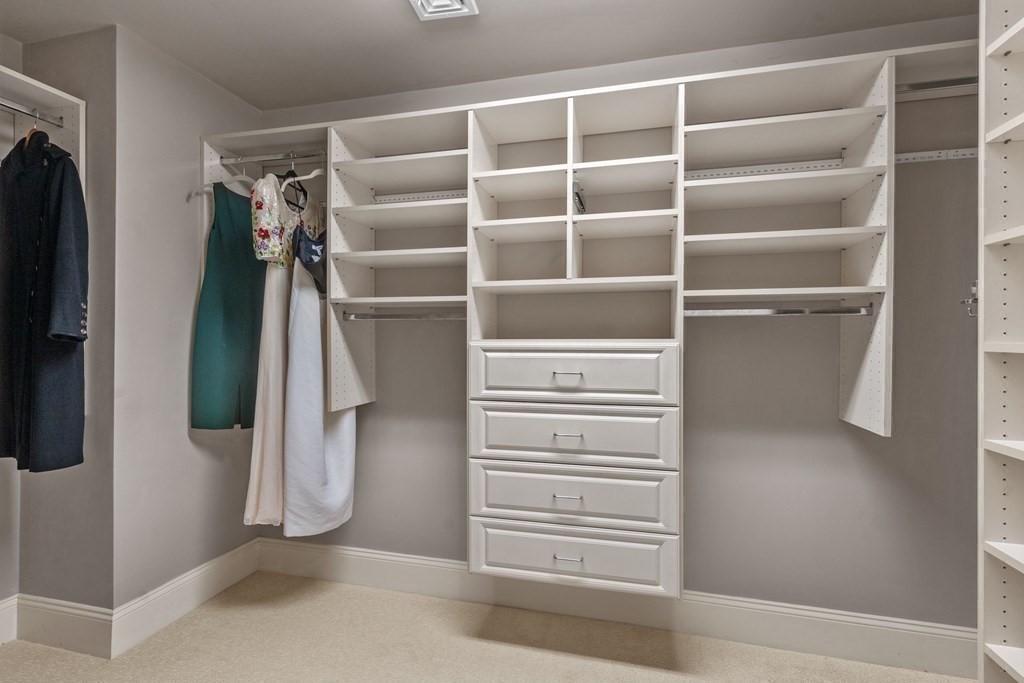 96 Beard Way Needham, MA 02492 - Photo 20 of 39 a view of walk in closet with clothes and shoes