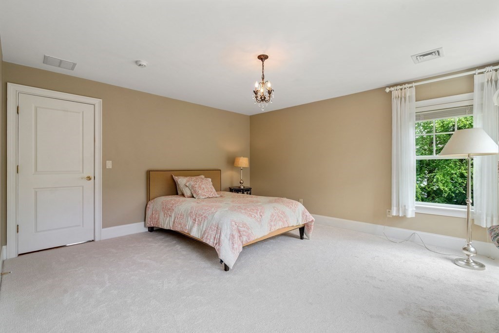 96 Beard Way Needham, MA 02492 - Photo 24 of 39 a bedroom with a bed and a window