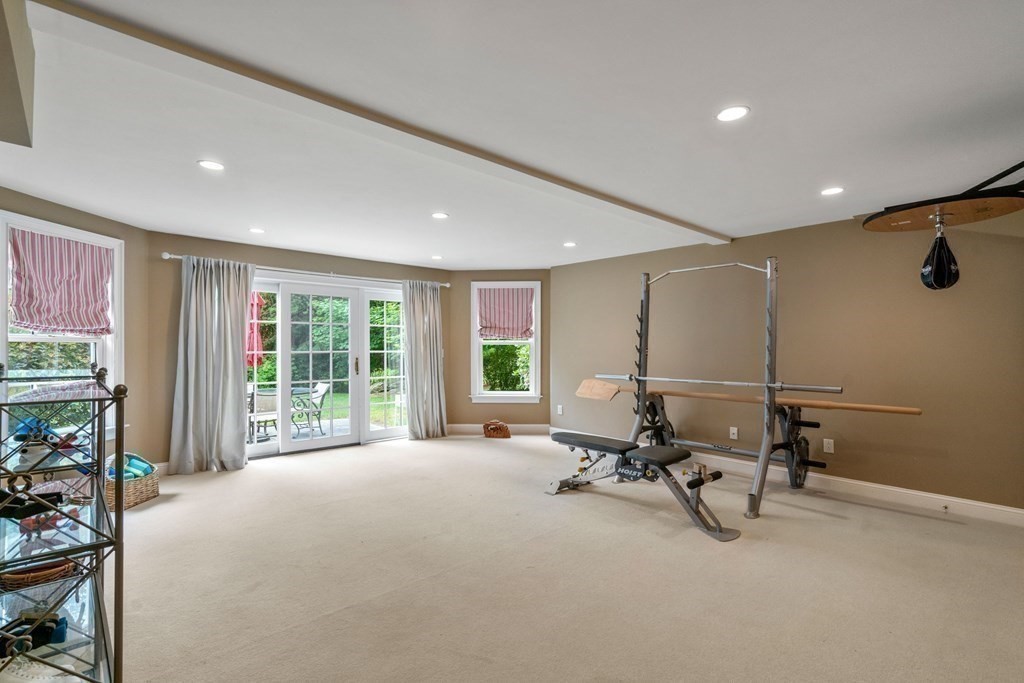 96 Beard Way Needham, MA 02492 - Photo 31 of 39 a view of a room with gym equipment and a large window