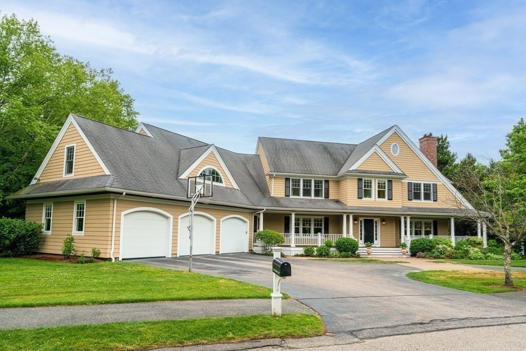 96 Beard Way Needham, MA 02492 - Photo 39 of 39 a front view of a house with a yard table and chairs