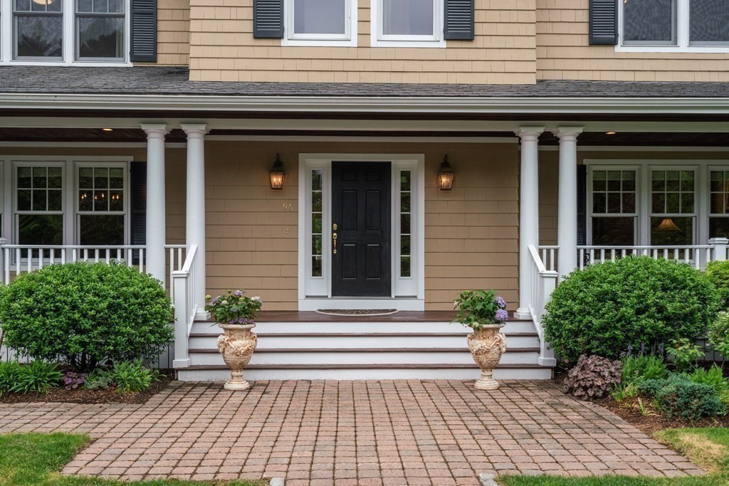 96 Beard Way Needham, MA 02492 - Photo 4 of 39 a view of a house with a window and bench