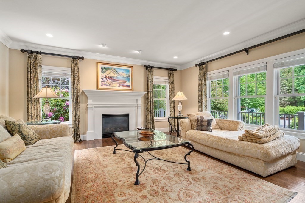 96 Beard Way Needham, MA 02492 - Photo 7 of 39 a living room with furniture and a fireplace