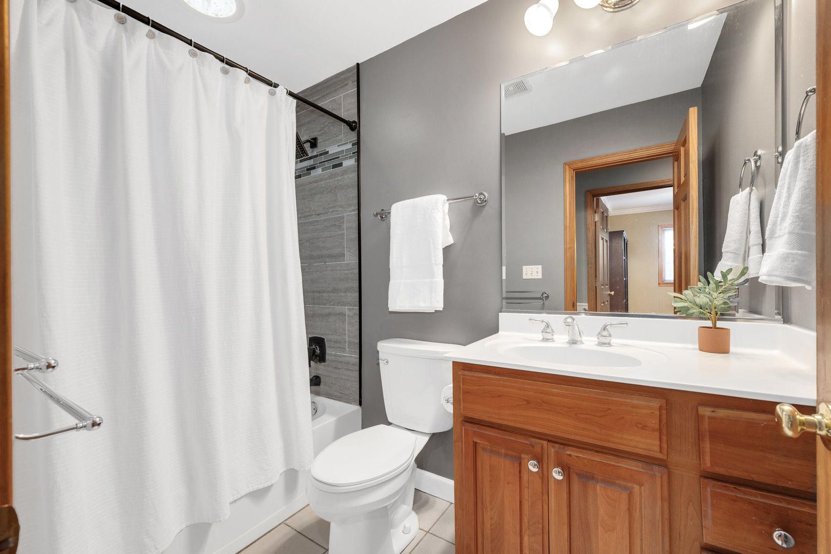 5305 Howard Avenue Western Springs, IL 60558 - Photo 19 of 35 a bathroom with a sink toilet and shower