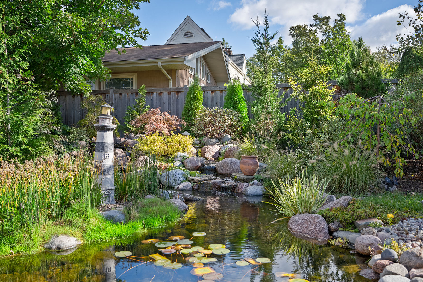5305 Howard Avenue Western Springs, IL 60558 - Photo 30 of 35 a front view of a house with a yard and a fountain
