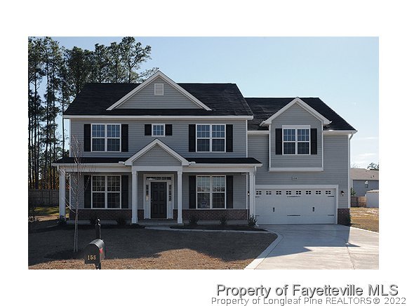 158 Shellbark Drive Spring Lake, NC 28390 - Photo 1 of 15 a front view of a house with a yard