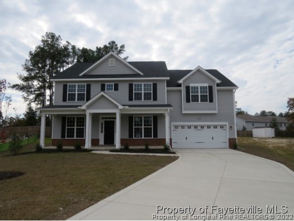 158 Shellbark Drive Spring Lake, NC 28390 - Photo 14 of 15 a front view of a house with a yard
